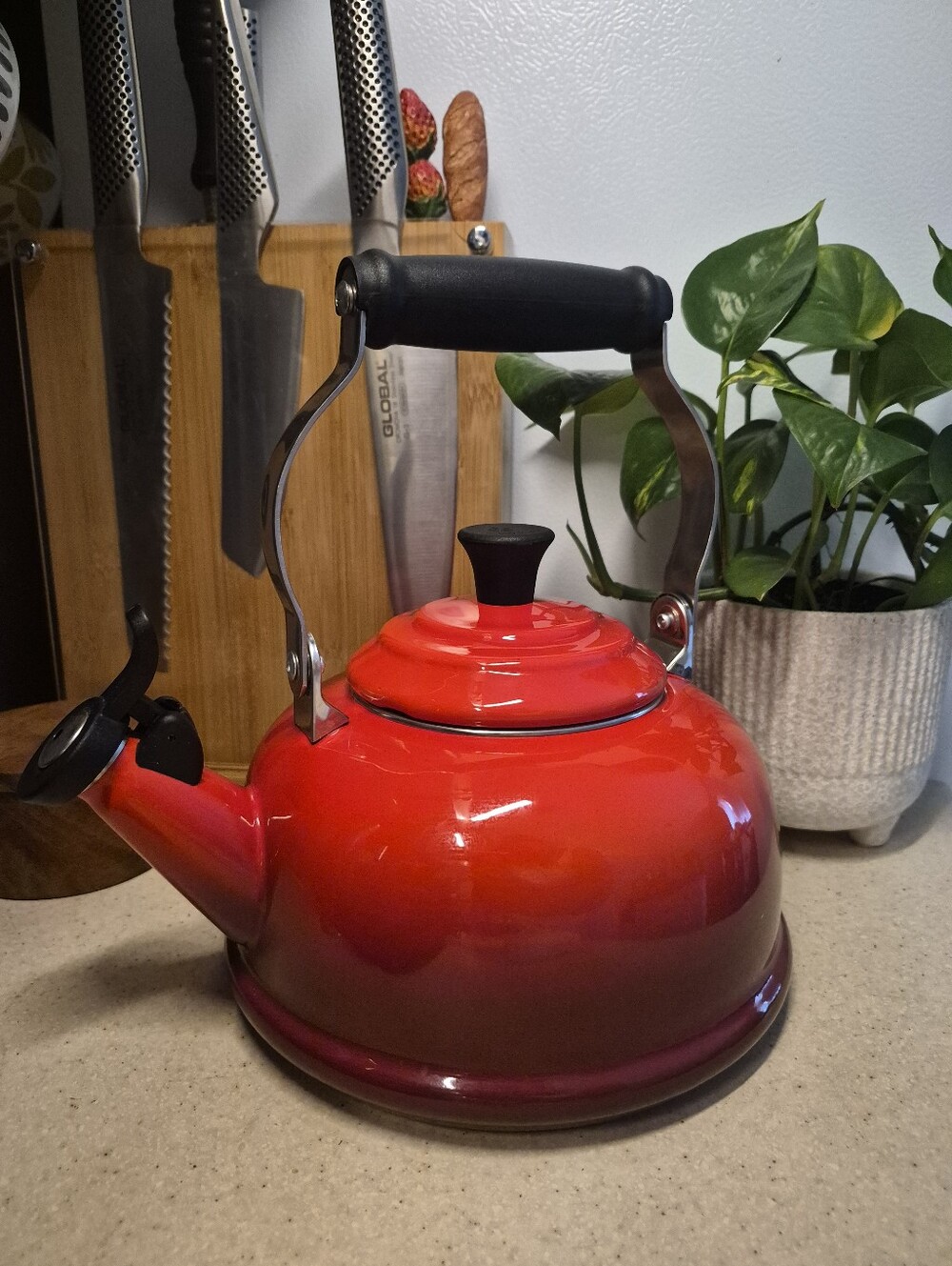 Le Creuset Red Enamel Whistling Stovetop Kettle with Black Handle